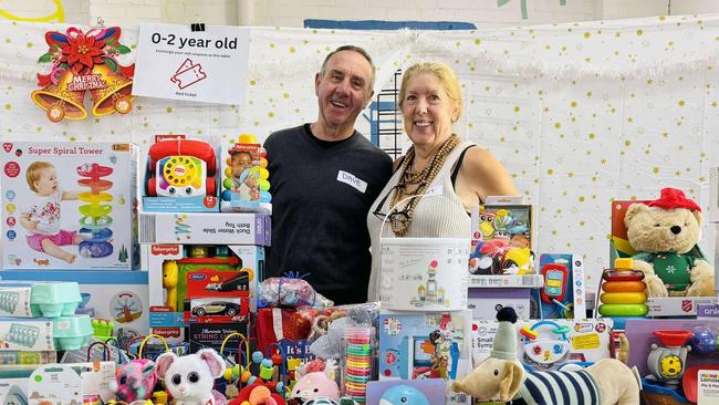 Hobart City Mission volunteers David Wilkinson and Janet Wilkinson with the many toys donated. Picture: Supplied.