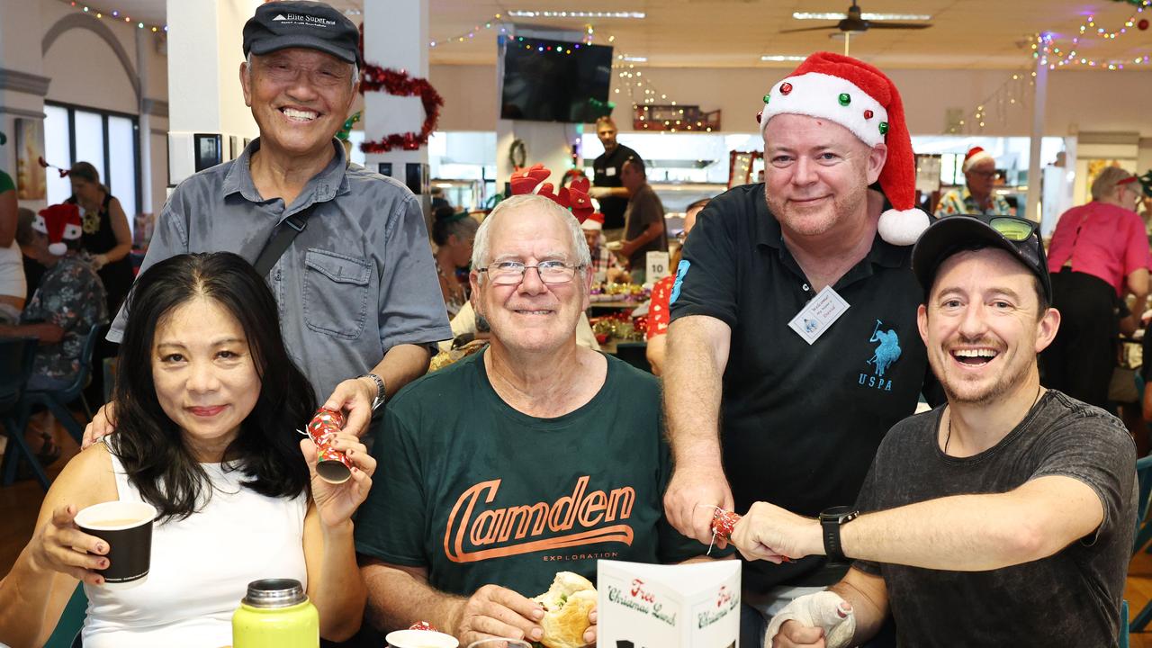 The Cairns Community Christmas Lunch was served up on Christmas day at St Augustine's College, free of charge, thanks to the generosity of Cairns businesses, personal donations and a small army of volunteers. Lily Romos, Dr The Pamir, Leon Ford, Cairns Community Christmas Lunch president David Lennie and Jeremy Thomas get into the festive spirit. Picture: Brendan Radke