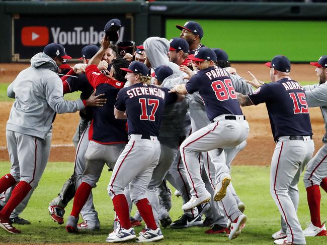 HOUSTON, TEXAS - OCTOBER 30: The Washington Nationals celebrate after defeating the Houston Astros in Game Seven to win the 2019 World Series at Minute Maid Park on October 30, 2019 in Houston, Texas. The Washington Nationals defeated the Houston Astros with a score of 6 to 2.   Tim Warner/Getty Images/AFP == FOR NEWSPAPERS, INTERNET, TELCOS & TELEVISION USE ONLY ==