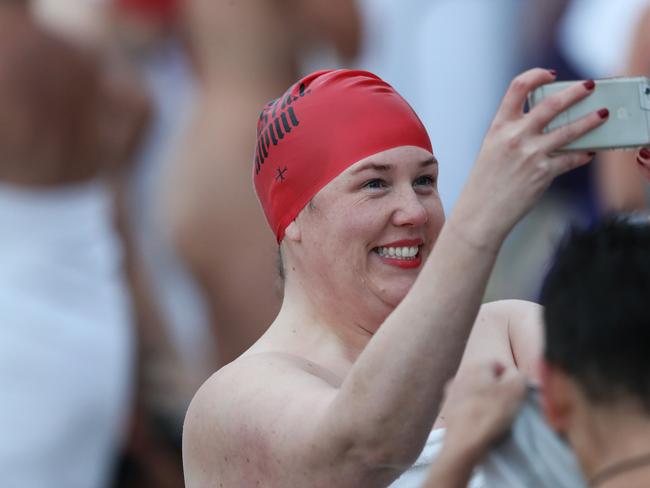 DARK MOFO 2019: Participants of the nude solstice swim brave the cold water at dawn at Long Beach, Sandy Bay. Picture: LUKE BOWDEN