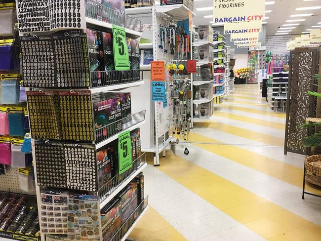 Bargains galore but no customers at this store in Brisbane’s Stafford Shopping Centre. Picture: AAP Image/Attila Csaszar