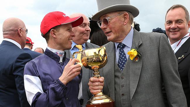 Kerrin McEvoy and Lloyd Williams celebrate Almandin’s win in the Melbourne Cup. Picture: Ian Currie