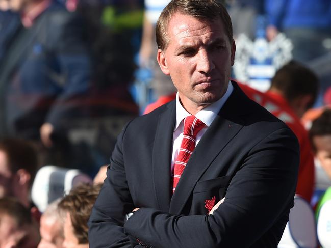 Liverpool manager Brendan Rodgers stands on the touchline ahead of their English Premier League soccer match against Queens Park Rangers at Loftus Road, London, Sunday, Oct. 19, 2014. (AP Photo/Tim Ireland)