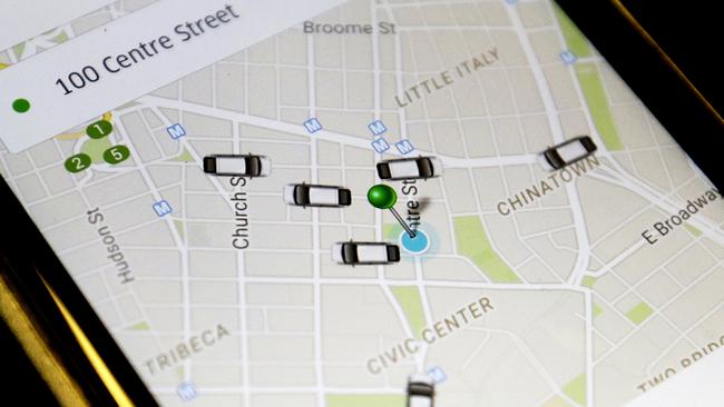 FILE - In this Wednesday, March 18, 2015, file photo, the Uber application displays cars available for a pick up at 100 Centre St on a cell phone in New York. In four years Uber has gone from nearly non-existent to more than 26,000 drivers, joining over 13, 000 New York City taxis. (AP Photo/Mary Altaffer, File)