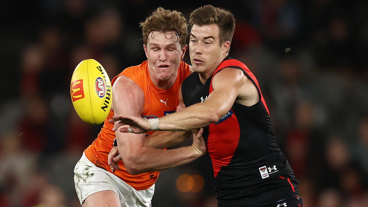 MELBOURNE . 09/04/2023. AFL . Round 4. Essendon vs Greater Western Sydney at Marvel Stadium. Zach Merrett of the Bombers and Tom Green of the Giants chase the bouncing footy during the 1st qtr. . Pic: Michael Klein