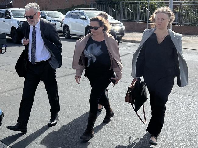 Rosemary Gamble (middle) leaving the Devonport Magistrates Court. Picture: Simon McGuire.