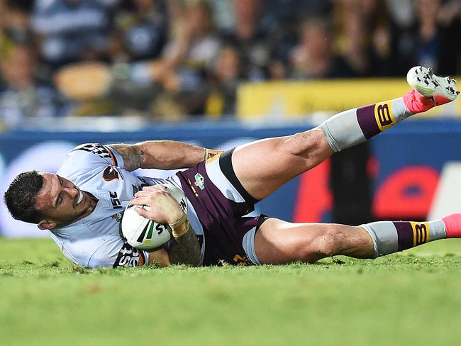 Darius Boyd clutches at his leg before half time. Picture: Zak Simmonds