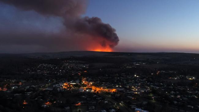 A photo of the Pechey bushfire at dusk on November 13, looking back from Crows Nest. PHOTO CREDIT: Matthew Eastgate Photography and Film