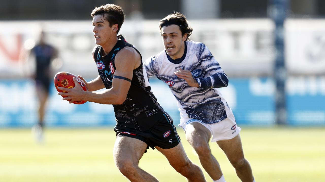 Cat Brad Close closes in on Power young gun Connor Rozee. Picture: Darrian Traynor/Getty Images