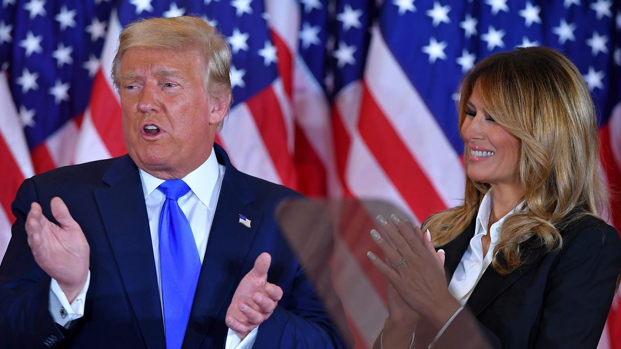 US President Donald Trump claps alongside US First Lady Melania Trump after speaking during election night. Picture: Mandel Ngan/AFP