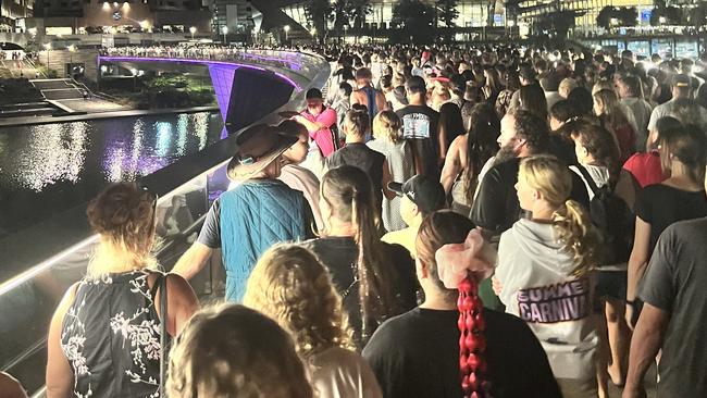 The oval footbridge was “packed like sardines at a shuffle pace”. Picture: Jo Schulz