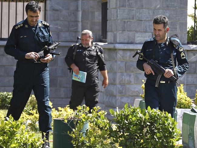 Police officers patrol Iran's parliament building after an assault by several attackers that was claimed by the Islamic State group, in Tehran, Iran.  Picture:  AP