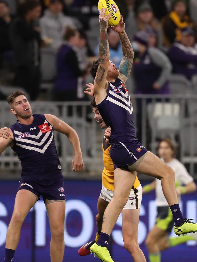 PERTH, AUSTRALIA – AUGUST 10: Nathan Wilson of the Dockers marks the ball during the round 11 AFL match between the Fremantle Dockers and the Hawthorn Hawks at Optus Stadium on August 10, 2020 in Perth, Australia. (Photo by Paul Kane/Getty Images)