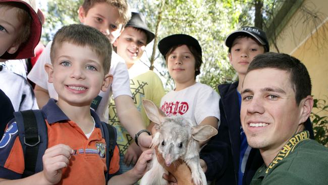 Handler Daniel Bewley with Timothy Fenech, 5, (left), in April 2011.