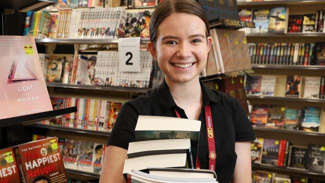 Sales assistant Lily Biggs, 18, at QBD Books at Carindale. Photographer: Liam Kidston