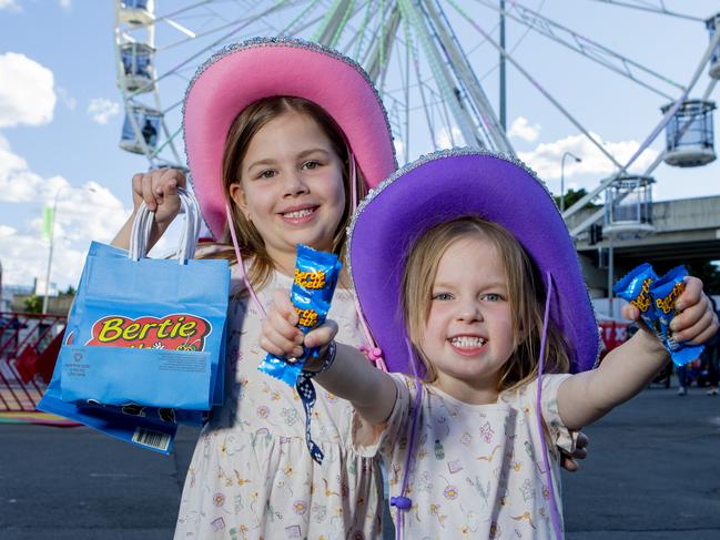 Sienna Rogers, 5, and Scarlett Rogers, 3 with their Bertie Beetle Show bags at the 2022 EKKA at RNA Showgrounds Picture: Jerad Williams