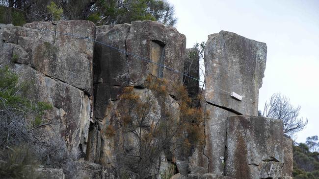 The precariously placed rock above the Tasman Highway. Picture: Chris Kidd