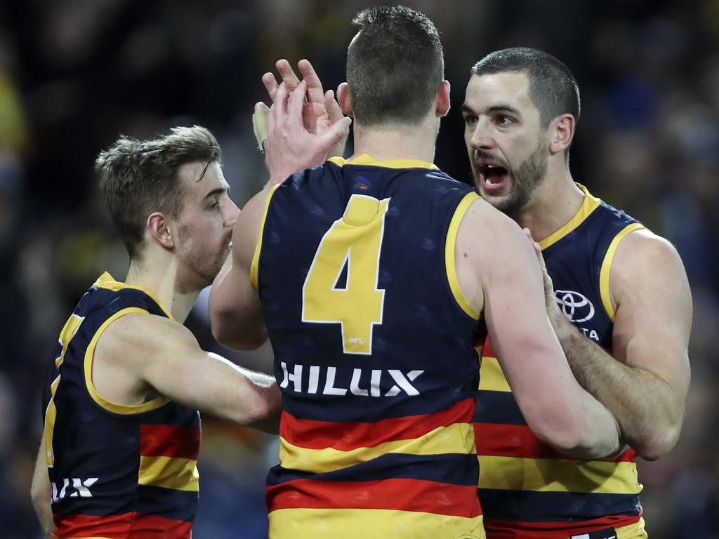 04/08/18 - AFL - Showdown 45 - Adelaide Crows v Port Adelaide at Adelaide Oval. Josh Jenkins kicks the winning goal. celebrating with Taylor Walker. Picture SARAH REED