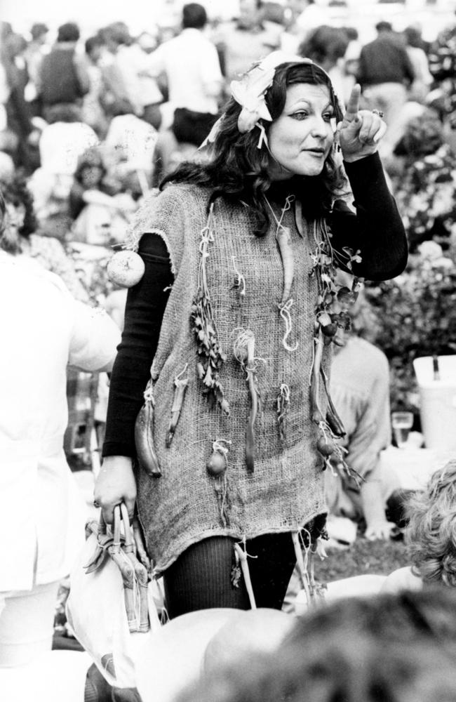 A woman dressed in a hessian sack complete with dangling vegetables attends the race in 1979.