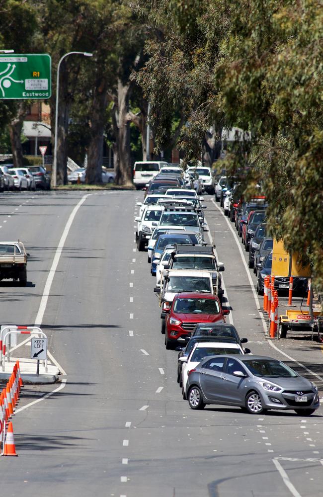 Cars queue for the COVID-19 testing facility at Victoria Park, just outside the Adelaide CBD yesterday. Picture: Kelly Barnes