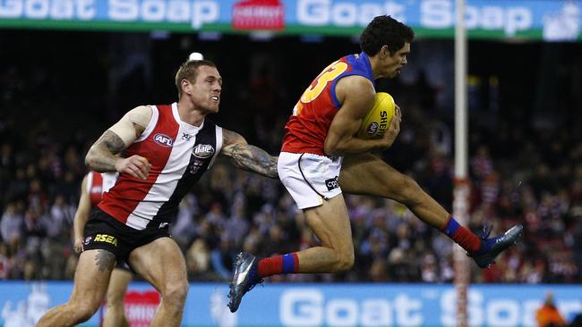 Charlie Cameron marks in front of St Kilda’s Tim Membrey. Picture: AAP