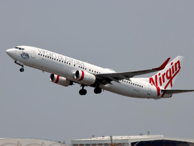 Virgin Australia plane departing from Brisbane Airport Pictures David Clark Photography