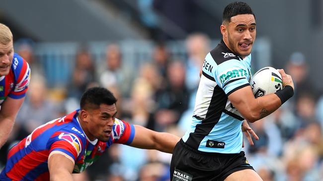 SYDNEY, AUSTRALIA — AUGUST 26: Valentine Holmes of the Sharks makes a break during the round 24 NRL match between the Cronulla Sharks and the Newcastle Knights at Southern Cross Group Stadium on August 26, 2018 in Sydney, Australia. (Photo by Cameron Spencer/Getty Images)