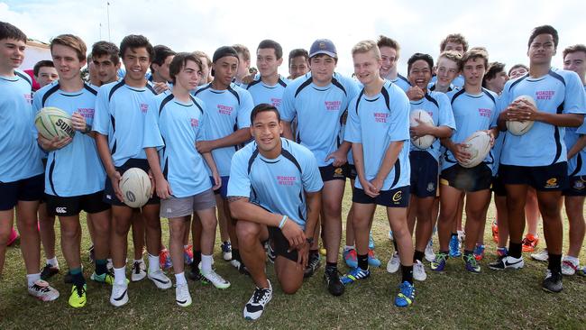 Israel Folau with the students at St Columban’s College in Caboolture. Picture: Glenn Barnes