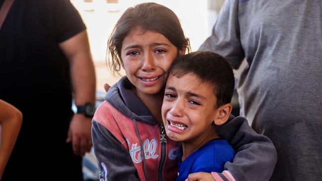 Children crying because of Israeli raids in Khan Yunis, Gaza. Picture: Ahmad Hasaballah/Getty Images