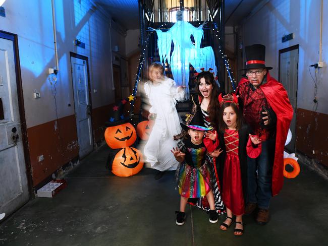 Elsa Symes ,Gary Joyce,Olivia Puopolo,5, and sister Emilia Puopolo,8, get an early scare at the Adelaide Gaol from ghost Elly Brake  for this years Wail at the Gaol Halloween Events .Thursday,October,14,2021.Picture Mark Brake