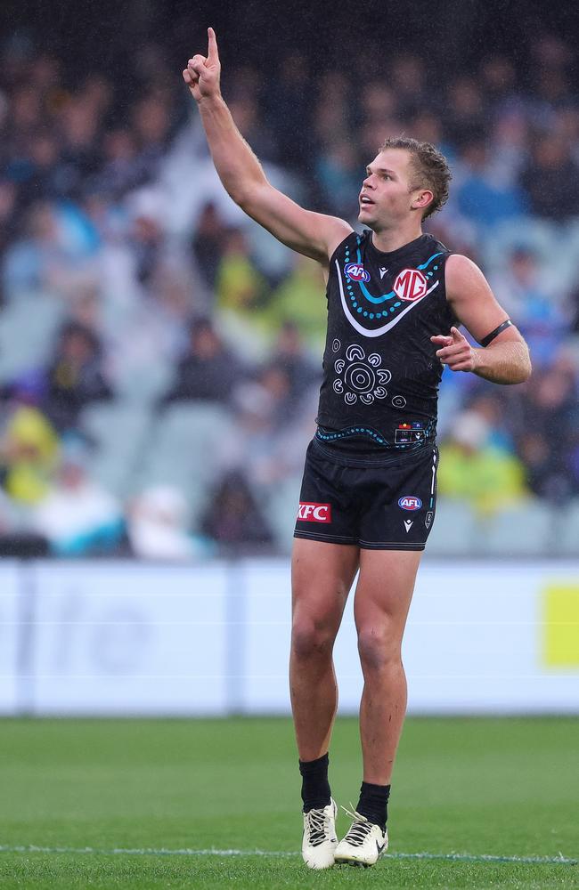 Dan Houston of the Power celebrates after kicking a goal from long range. Picture: Sarah Reed/AFL Photos via Getty Images.