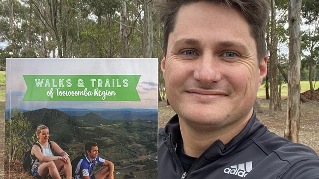 Cr Tim McMahon with the new Walks and Trails of Toowoomba Region Guide.