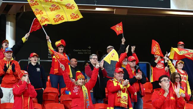 Suns fans cheer during the round 4 AFL match between the Gold Coast Suns and Fremantle Dockers at Metricon Stadium on June 27, 2020 in Gold Coast, Australia. (Photo by Jono Searle/AFL Photos/via Getty Images )