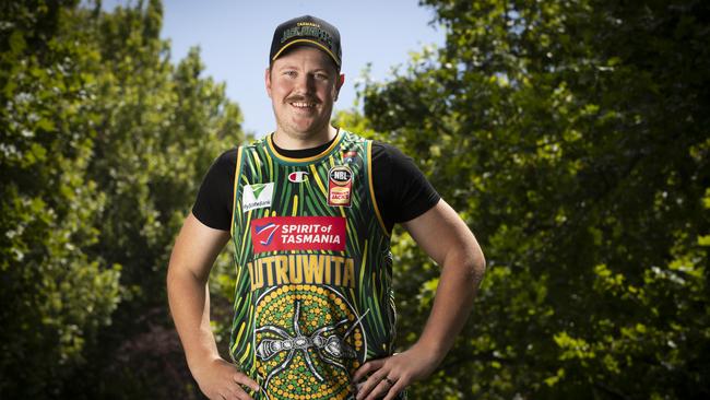 Indigenous artist Reuben Oates wearing his JackJumpers dot design jersey. Picture: Chris Kidd