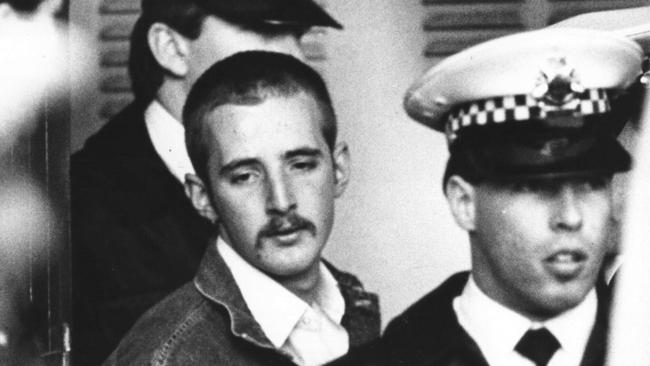 Knight leaving the coroners court in July 1988 under heavy police guard. He was 19 when he shot dead 7 people and wounded 19 in Hoddle Street, Clifton Hill, Victoria. Picture: Michael Potter