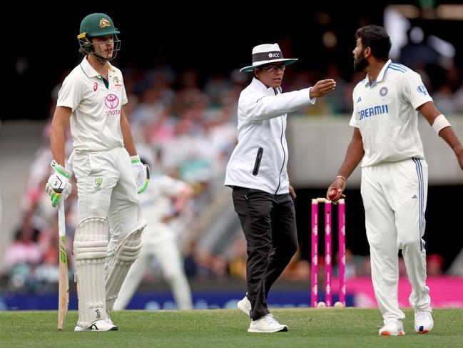 Sam Konstas (L) and India’s captain Jasprit Bumrah (R) share words late on day one. Picture: Getty