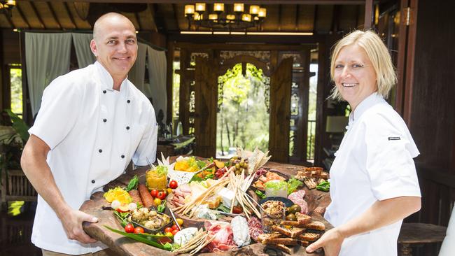 Chefs Ben Holloway and Lisa Mahar hold the Welcome Platter that greets guests on arrival at a rejuvenated Makepeace Island. Picture: Lachie Millard