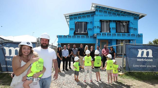 The home being built for the family of Kelly Wilkinson. Danielle Carroll and Rhys Carroll with the children, check out the new home being built for them by builders and volunteers. Picture Glenn Hampson