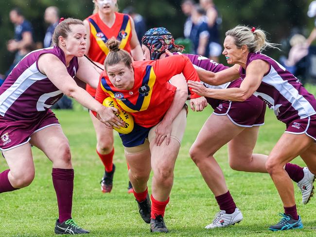 The explosion in female athletes at the AFL Masters Nationals has helped the tournament break the record number of players.