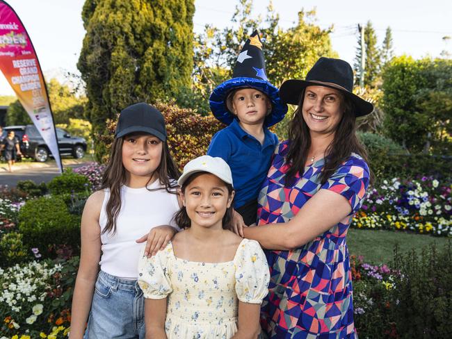 Roma vistors Tennille Rhodes with her kids (from left) Eden, Zara and Isaac Rhodes in The Chronicle Garden Competition City Reserve Grand Champion garden of Cheryl Ganzer during the Carnival of Flowers, Saturday, September 21, 2024. Picture: Kevin Farmer