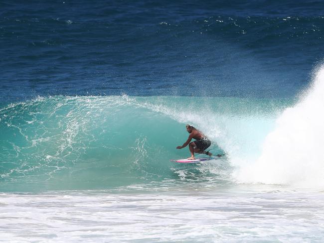 Mick Fanning rides a wave at Kirra during the large swell produced by Cyclone OMA. Photograph : Jason O’Brien.