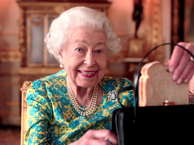 Queen Elizabeth II has died at age 96  - The Queen and Paddington Bear enjoy a maamalade sandwich during the Platinum Party at the Palace for the 70th Jubilee. Supplied