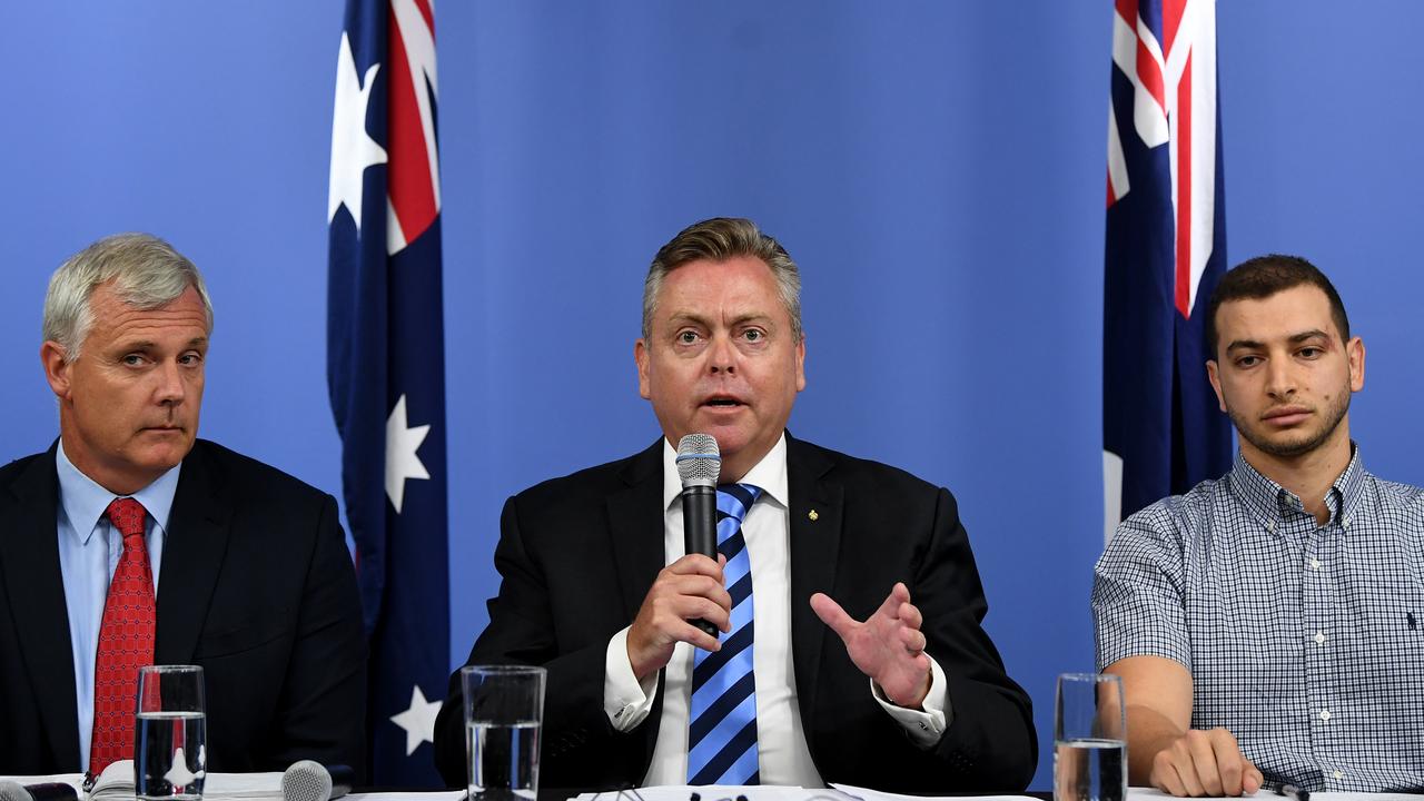 NSW Minister for Planning and Housing Anthony Roberts addresses the media with Professor Mark Hoffman (left) and Chairman of the Opal Tower body corporate Shady Eskander. Picture: Joel Carrett/AAP.