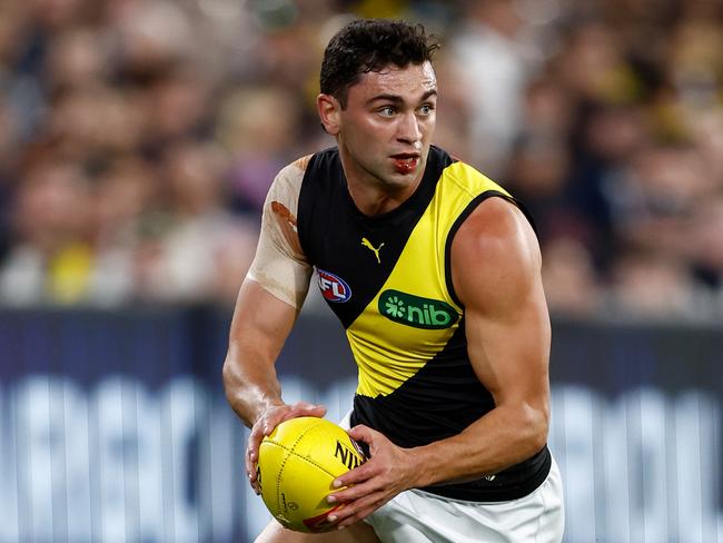 MELBOURNE, AUSTRALIA - MARCH 14: Tim Taranto of the Tigers in action during the 2024 AFL Round 01 match between the Carlton Blues and the Richmond Tigers at the Melbourne Cricket Ground on March 14, 2024 in Melbourne, Australia. (Photo by Michael Willson/AFL Photos via Getty Images)