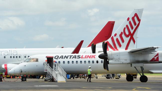 Generic photographs at Townsville Airport. A Virgin Airlines plane and a Qantas plane. Picture: Evan Morgan