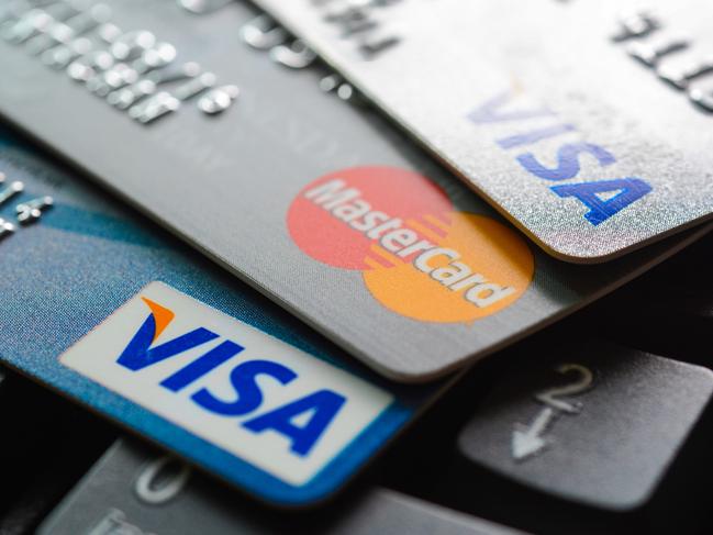 Bangkok, Thailand - Jun 23, 2015 : Group of credit cards on computer keyboard with VISA and MasterCard brand logos