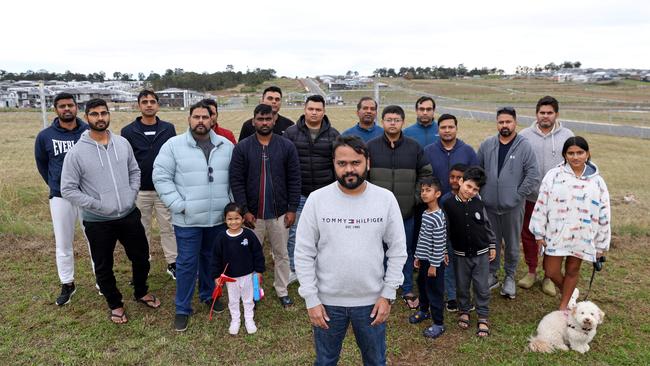 \Aravind Vijay (Centre, gray top) and locals pictured in Box Hill, where the community is campaigning to get the state government to build a new school. Picture: Damian Shaw