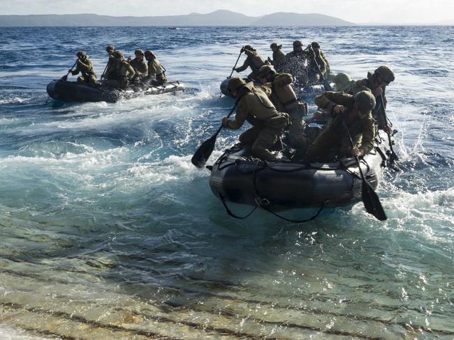 Australian soldiers take part in a joint amphibious assault raid exercise.