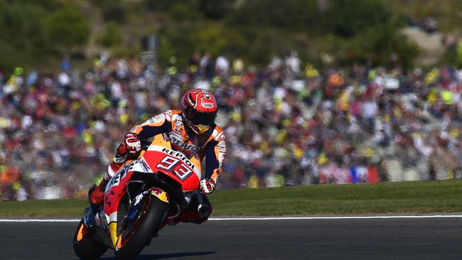 Repsol Honda Team’s Spanish rider Marc Marquez takes a curve at Ricardo Tormo racetrack.