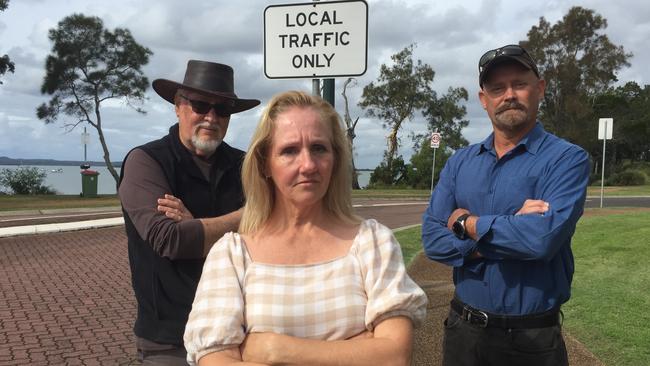 Orchard Grove resident Barry Gill with fellow residents Kirsten and Steven Komorowski at the intersection in Redland Bay they would like to see blocked off. Picture: Marcel Baum